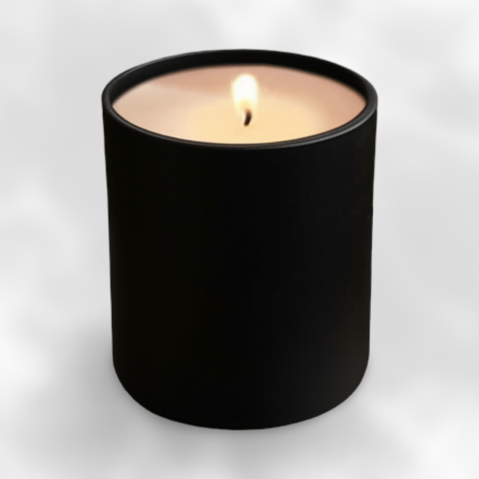 Black candle in a black container on a white background from Mystic Melts.